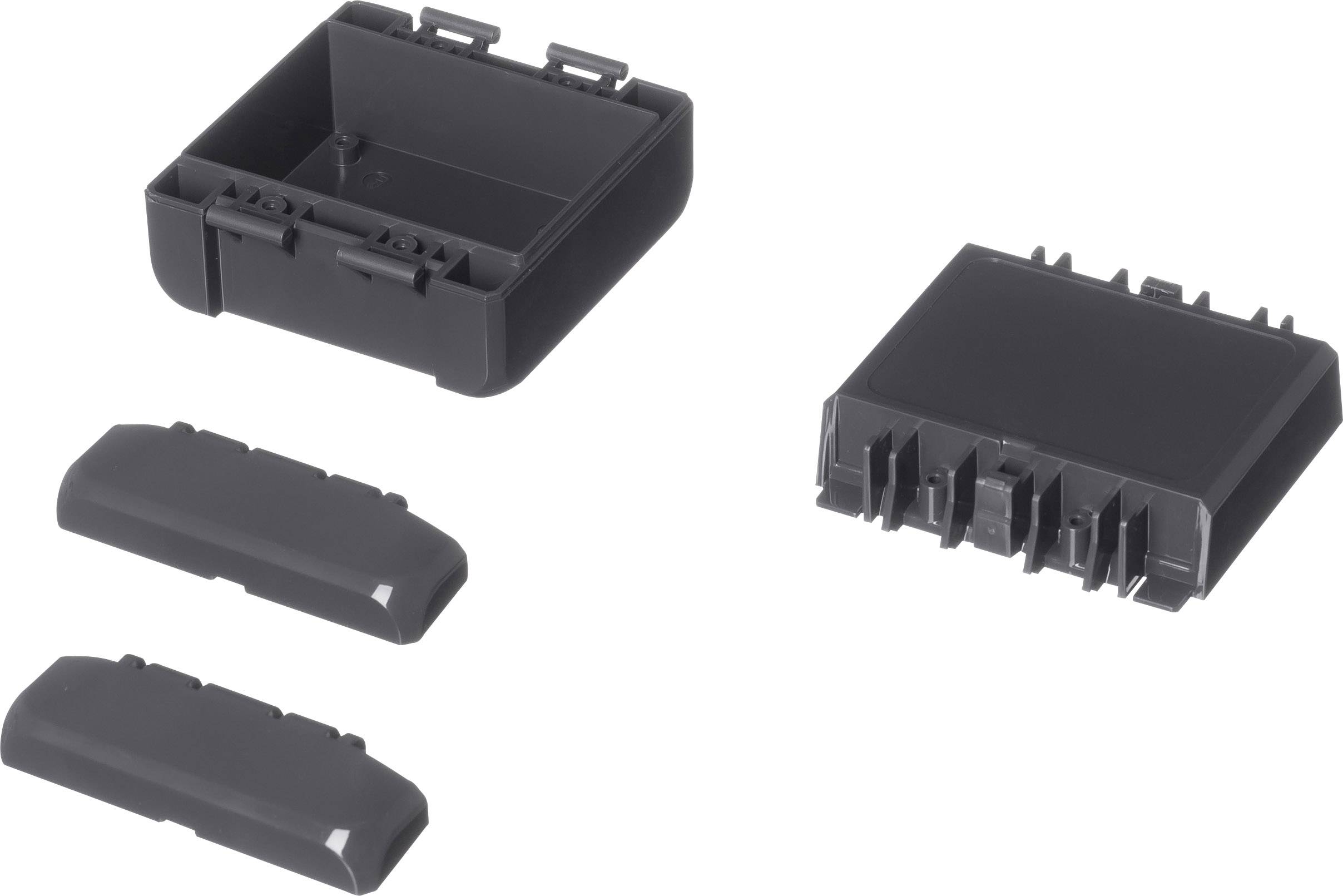'Four black plastic components, including a rectangular box and three covers, each with different openings and clips.'