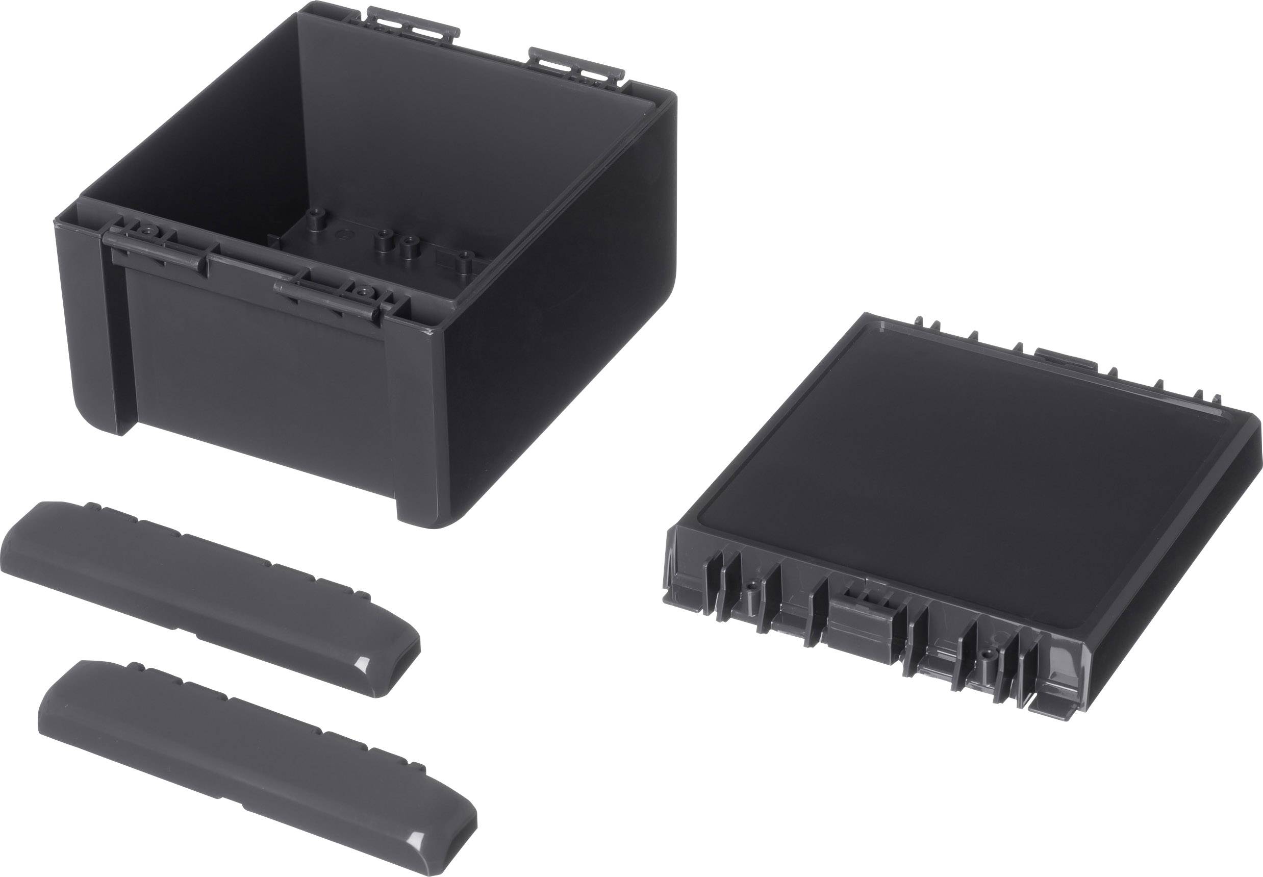 Black, rectangular plastic container with removable lid. Two smaller, elongated covers lie beside it.