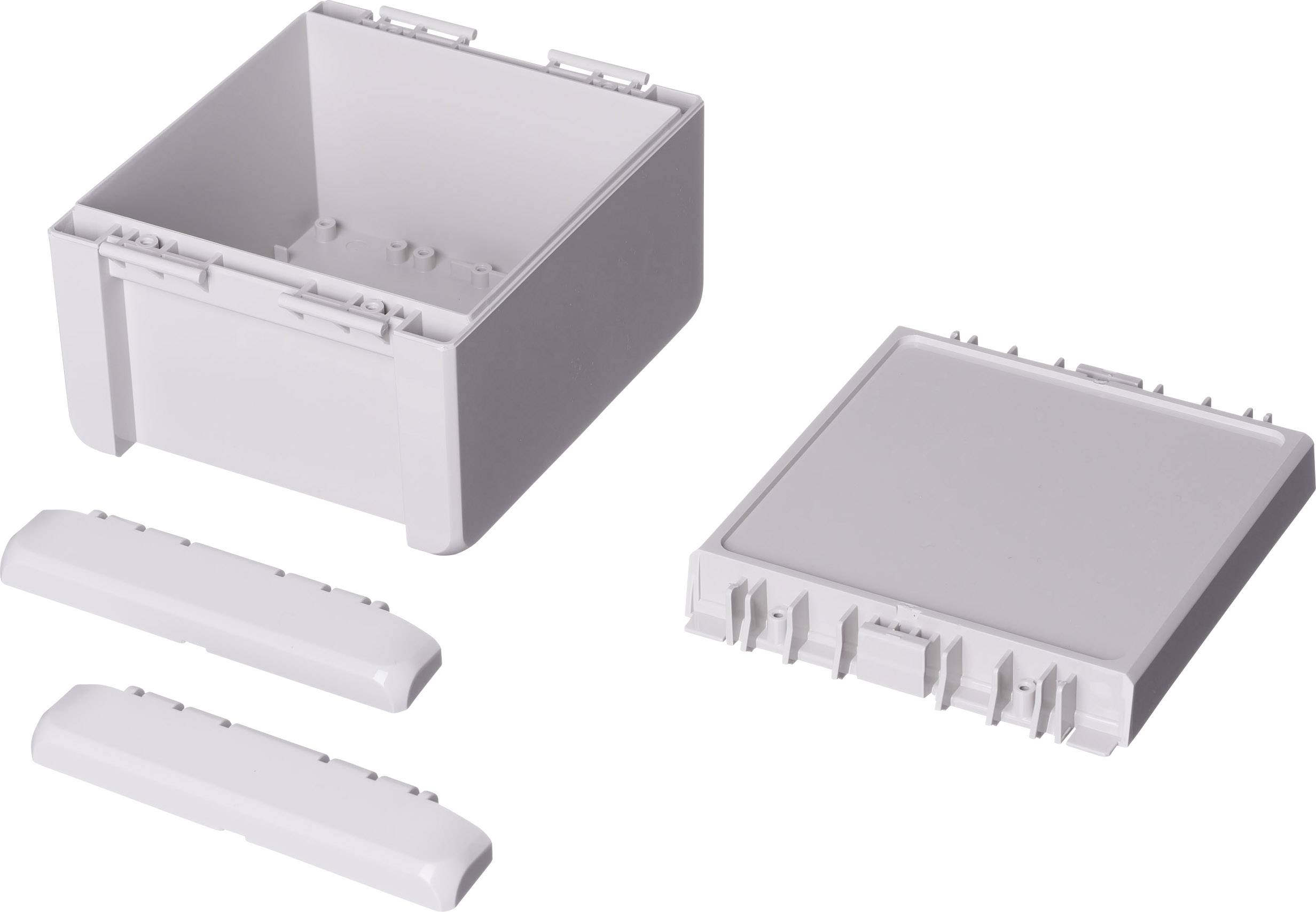 A grey plastic housing in individual parts: a box, a lid, and two side panels.