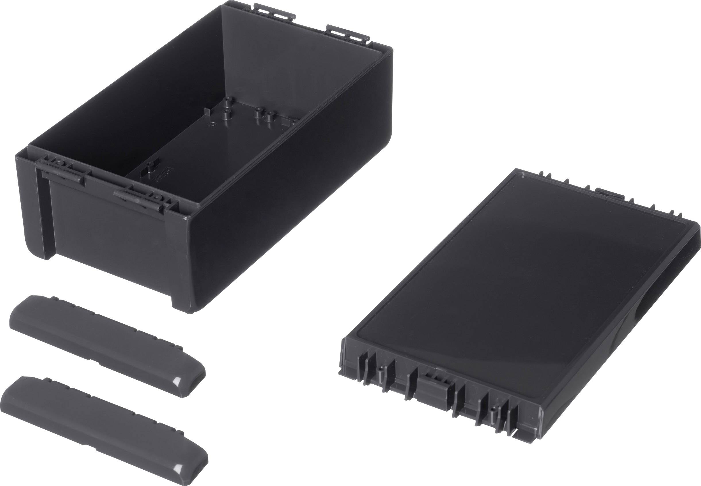 Black plastic casing consisting of a rectangular container, a lid, and two side covers, disassembled.