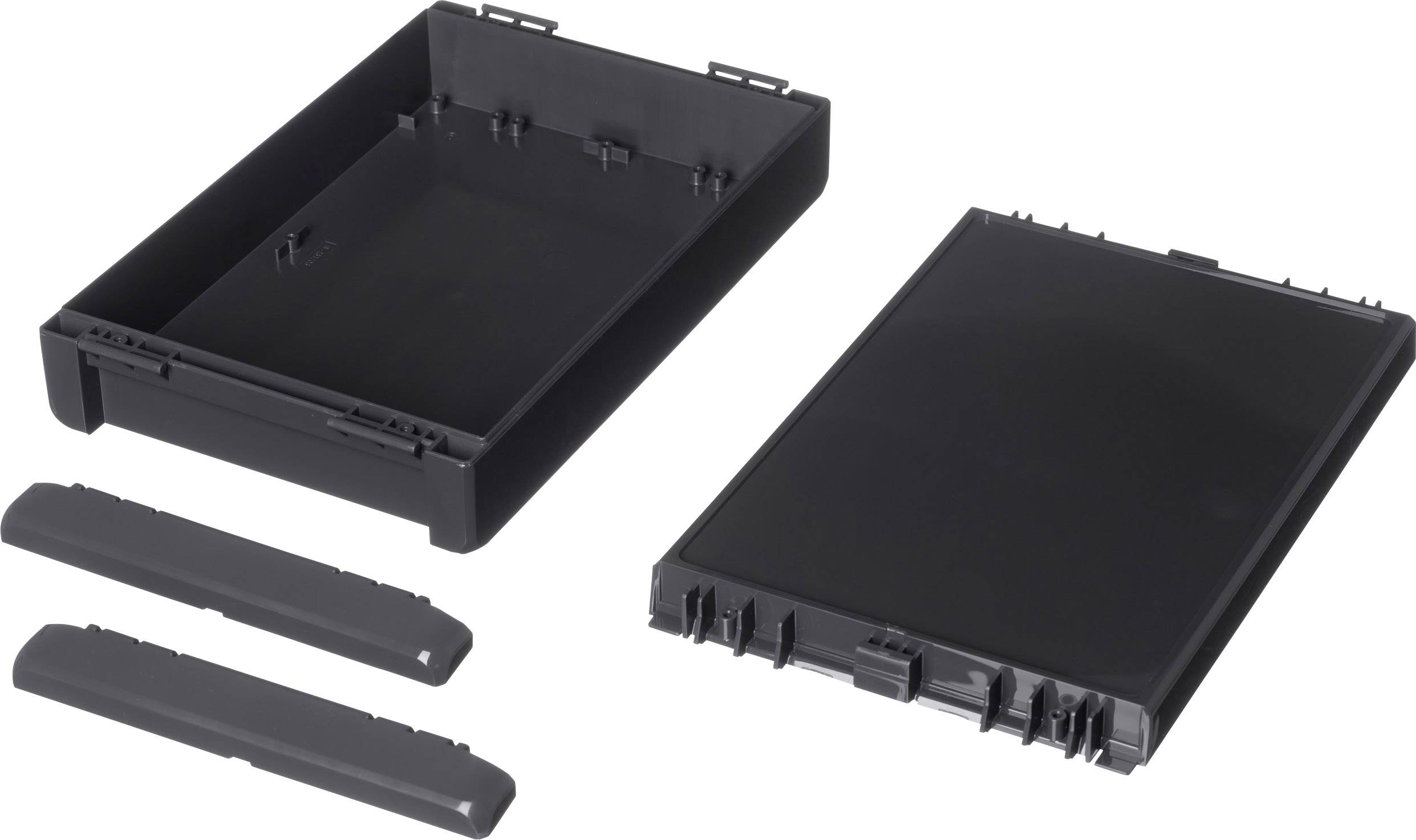 Plastic housing components in black, consisting of a rectangular tray, a lid, and two narrow strips.