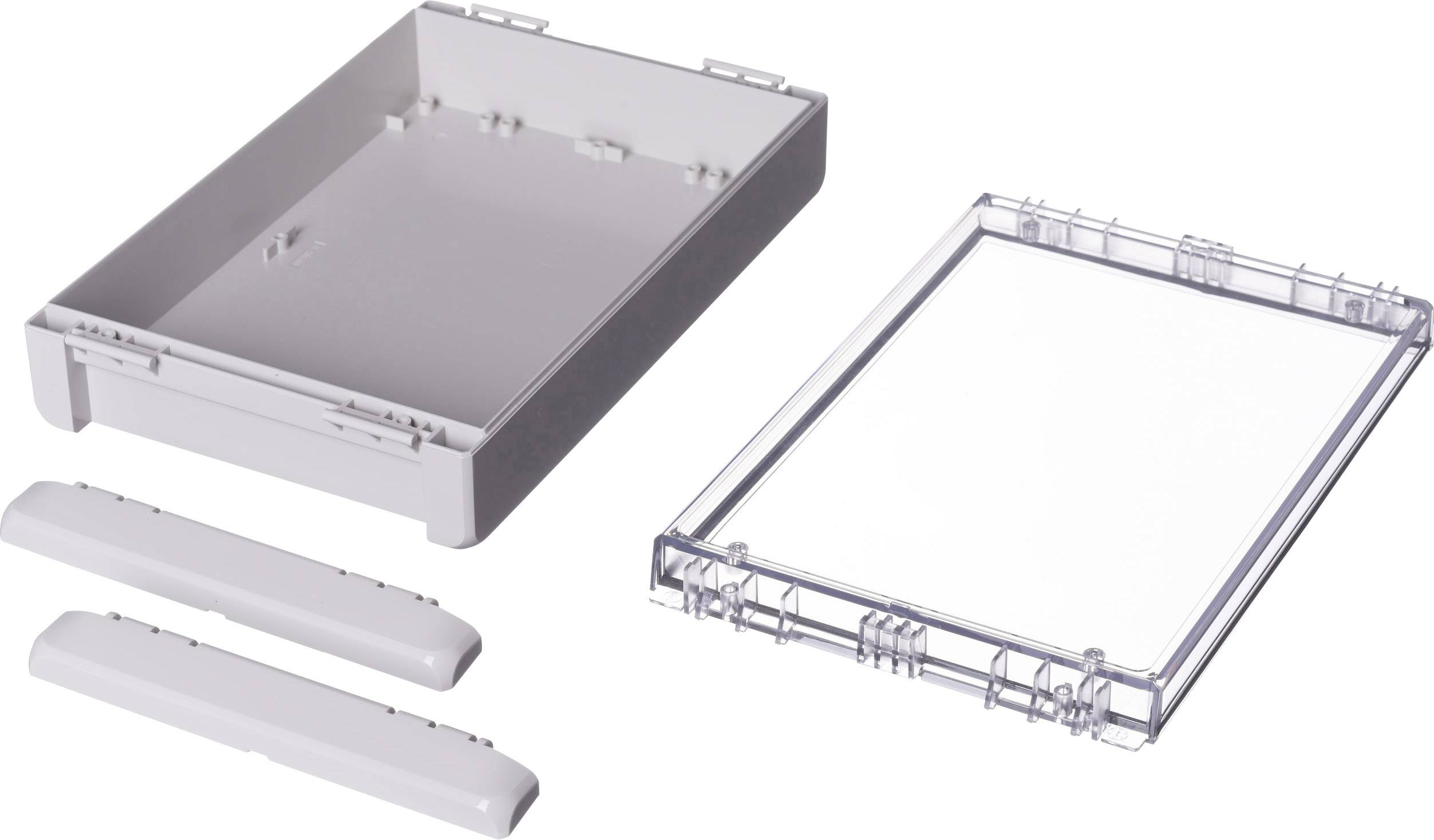 Plastic enclosure kit in individual parts: rectangular base plate, transparent cover, and two side panels.