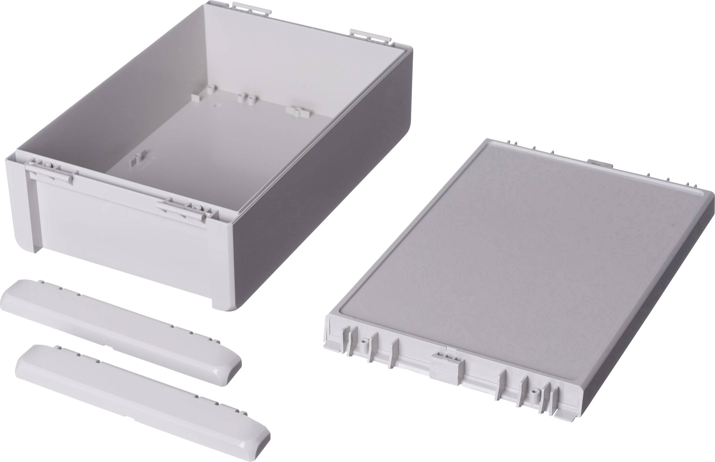 Two white plastic enclosures and a lid. One is an open box, the other the matching lid with two attachment strips.