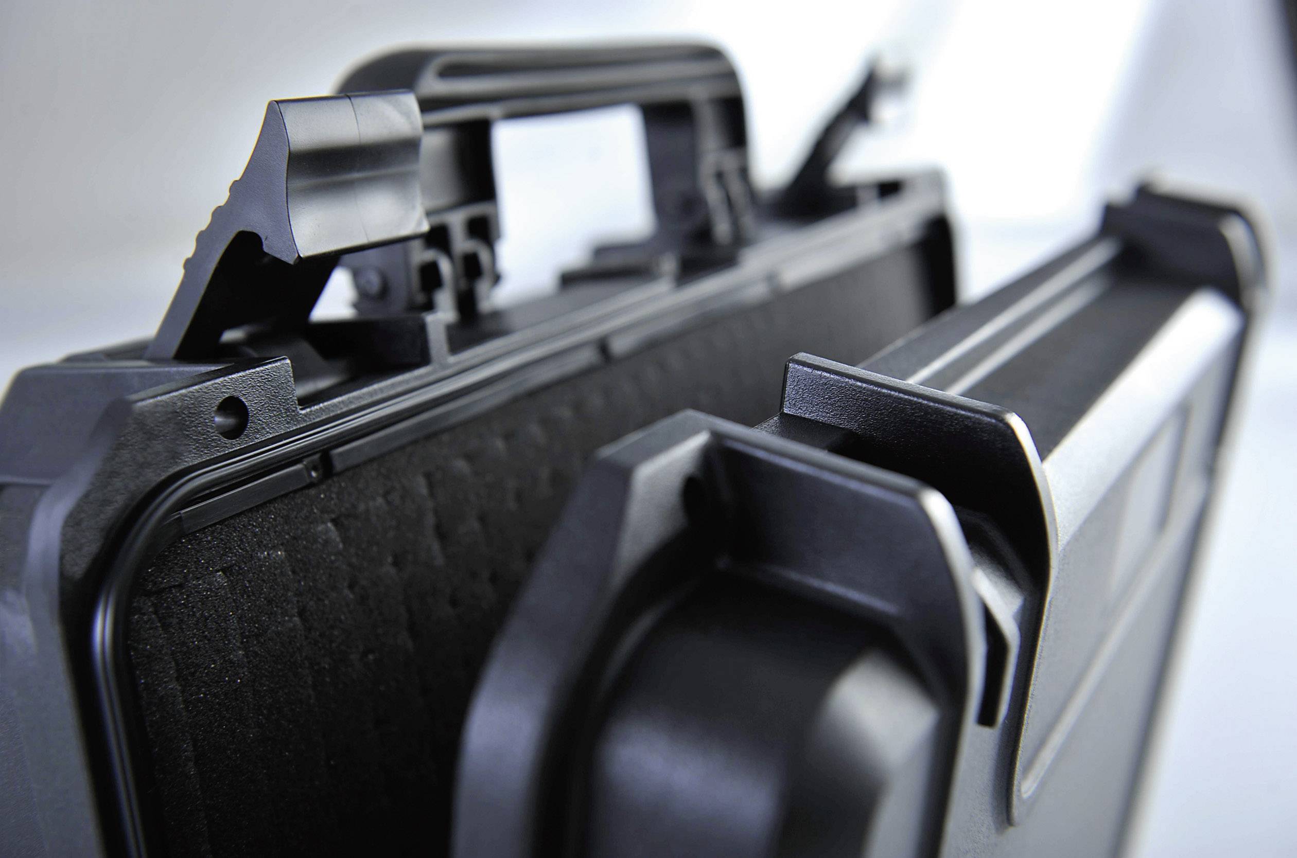 'Close-up of an opened black hard-shell case with foam lining, suitable for safely transporting delicate items.'