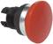 A large, round, red emergency stop button with a black base, used in emergency situations for rapid machine shutdown.