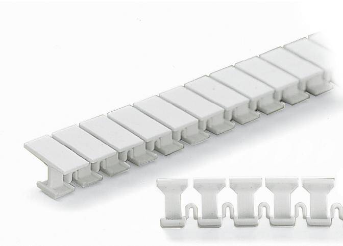 A white plastic profile, consisting of uniformly arranged hooks, extends diagonally. In the foreground, the profile is visible in a detailed view.