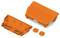 Two orange plastic housing components and two round covers are lying side by side. They are intended for electrical components.
