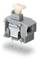 A grey, rectangular electrical changeover switch with two metal pins for installation in a device.
