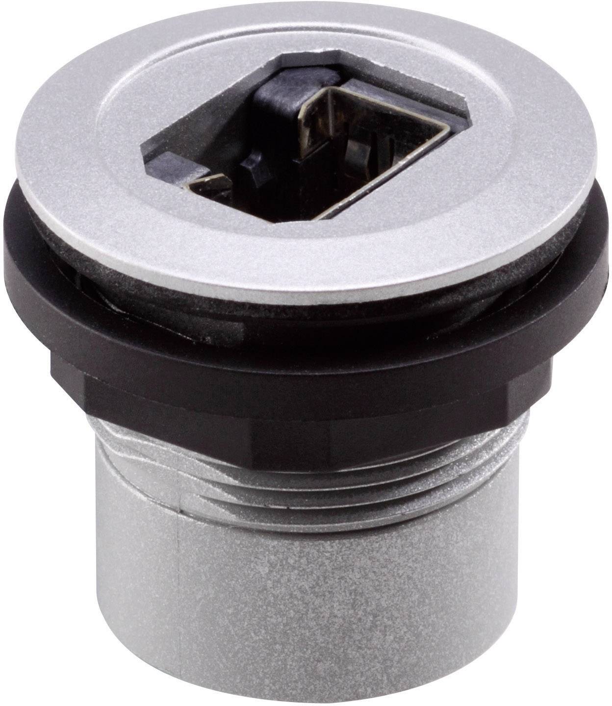'USB port in a circular metal housing, suitable for installation in devices or furniture. Shows a recessed, rectangular port.'