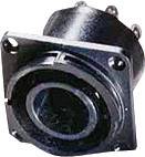 A round black plug socket with four screws on a mounting plate. Suitable for electrical connections.