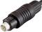 A six-pin DIN plug in close-up. The plug is black with a round, ridged grip for easy handling.