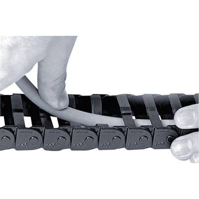 A hand is placing a cable into a black energy chain guide. The chain has multiple links that organise and protect the cable.