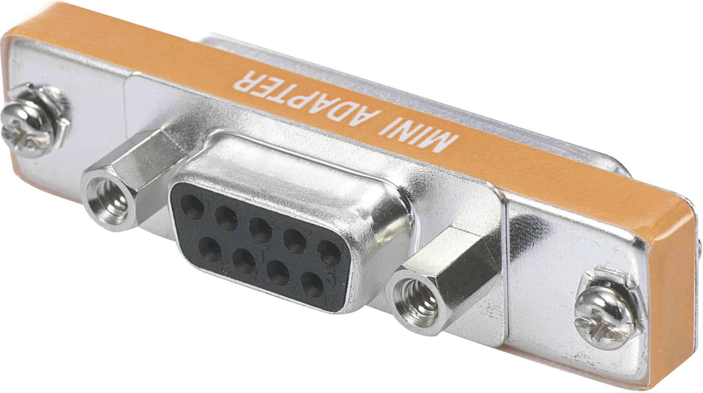 A silver mini-adapter with nine pins and side screws, marked in orange with the inscription 'MINI ADAPTER'.