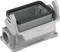 A rectangular metal housing with two side brackets for mounting. Open at the top, with a round connection at the bottom.