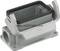 Metallic connector housing by HARTING, open and without cables, with robust design, suitable for industrial applications.
