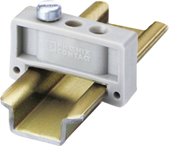 A grey plastic clip on a brass mounting rail, suitable for securing electrical components.