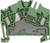 A green electrical terminal block in cross-section, showing the internal metal connections and housing structure.