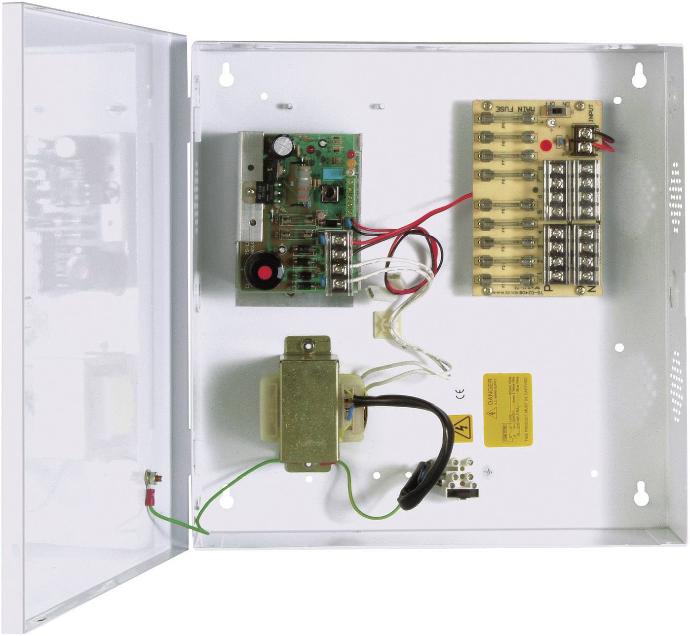 Open electrical fuse box with various circuit boards, cables, and a transformer.
