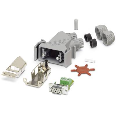 Components of a D-Sub connector: grey housing, metal clips, screws and circuit board. Components for electrical connection assembly.