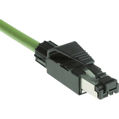 A green network cable with a black RJ45 plug, partially featuring a metal shield, is lying on a smooth surface.