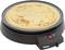 A freshly made pancake lies on an electric crepe maker with indicator lights and a temperature control.