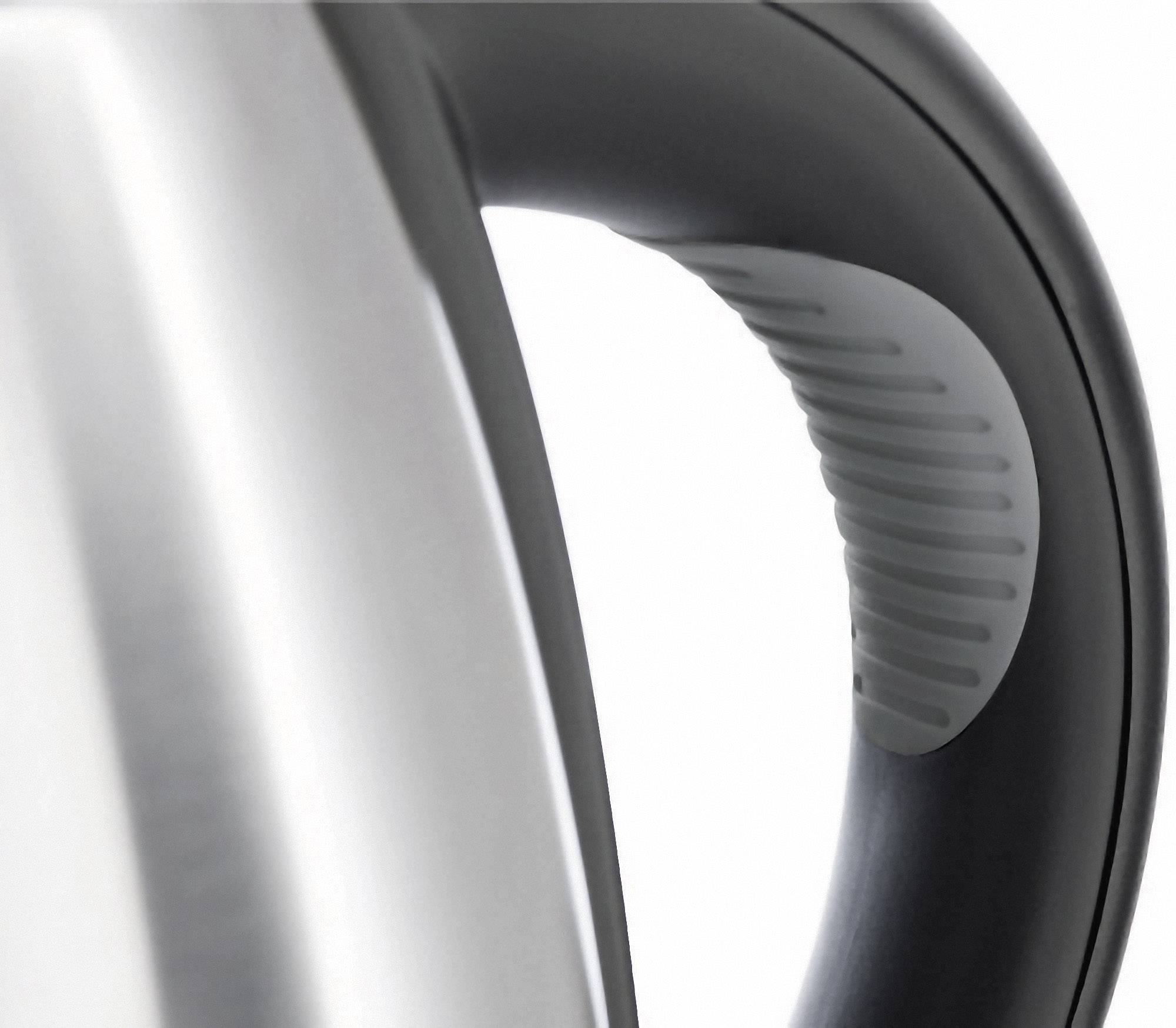 A silver kettle with a black handle, partially visible in the image.