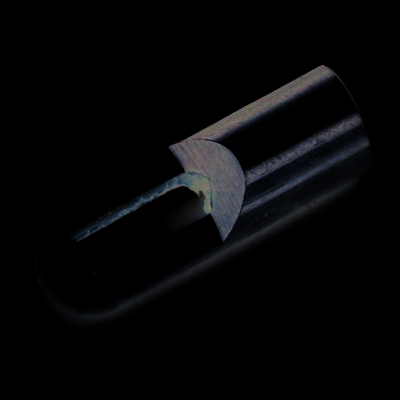 A metal component with an elongated shape, an open slot, and rounded edges, potentially serving a decorative or functional purpose.