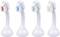 Four white toothbrush heads in a row, each with differently coloured indicator bristles: red, blue, green and yellow.