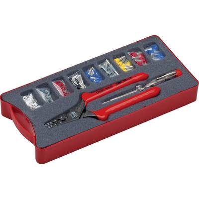 A set of electrician's tools in a red box, including a cable cutter, a voltage tester and various cable clips.