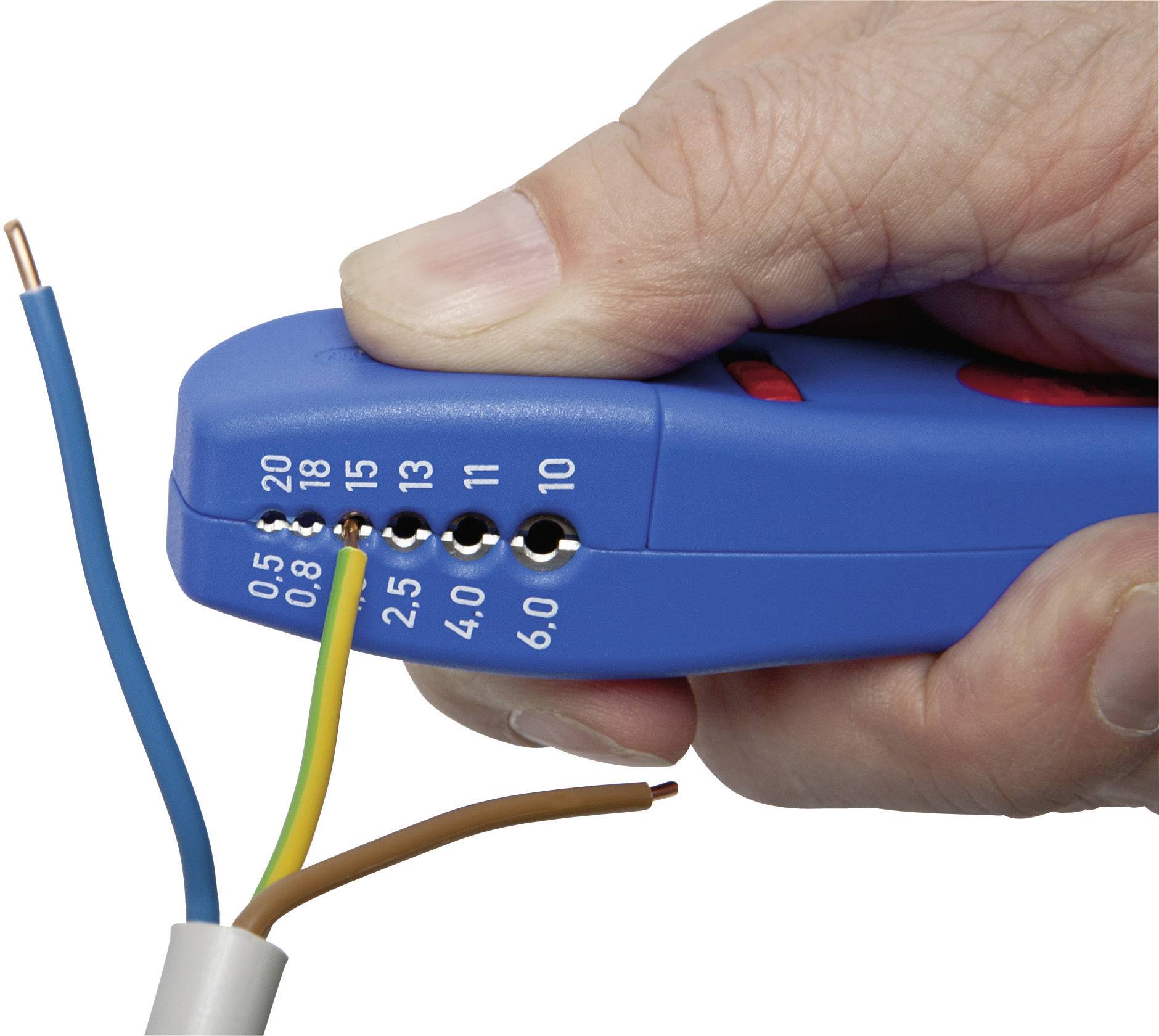 A hand is holding a blue wire stripping tool and removing the insulation from a multi-core cable to expose the wires.
