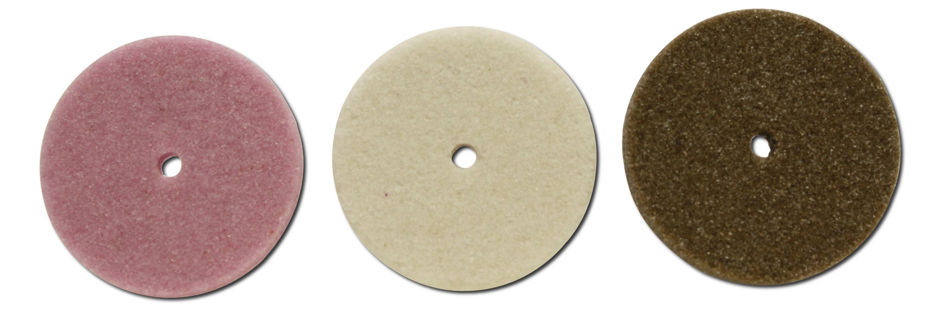 Three polishing discs in pink, beige, and brown, arranged side by side. Each disc has a hole in the centre.
