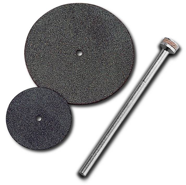 Two black grinding discs in different sizes and a metal rod lying side by side on a white background.