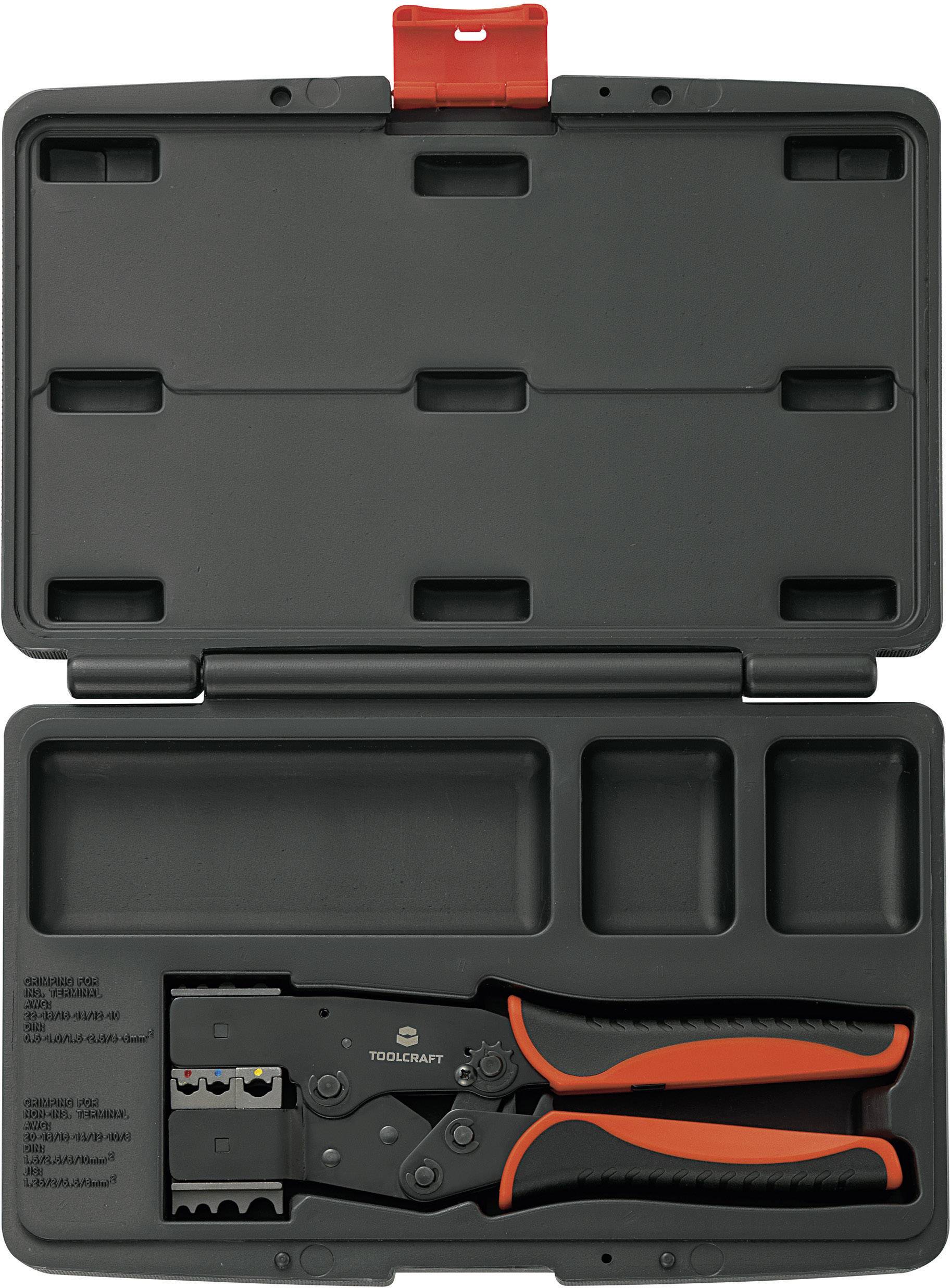 An open black toolbox with a crimping plier and three empty compartments.