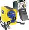 Yellow welding machine with accessories: carry case, welding helmet, and wire brush. Brand name and model number are visible.