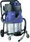 Industrial wet and dry vacuum cleaner with robust metal housing, large wheels, and a long suction hose for heavy-duty cleaning tasks.