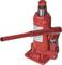 A red hydraulic jack with a lever for height adjustment. Suitable for lifting heavy loads during repair or maintenance work.