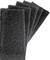 Six black scouring sponges made of coarse material, arranged in a fan-like pattern. Suitable for cleaning or scrubbing surfaces.