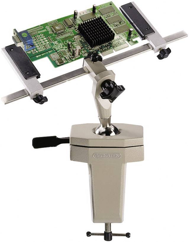 A circuit board is securely clamped in a bench holder with a rotary mechanism, possibly for assembly or repair work.
