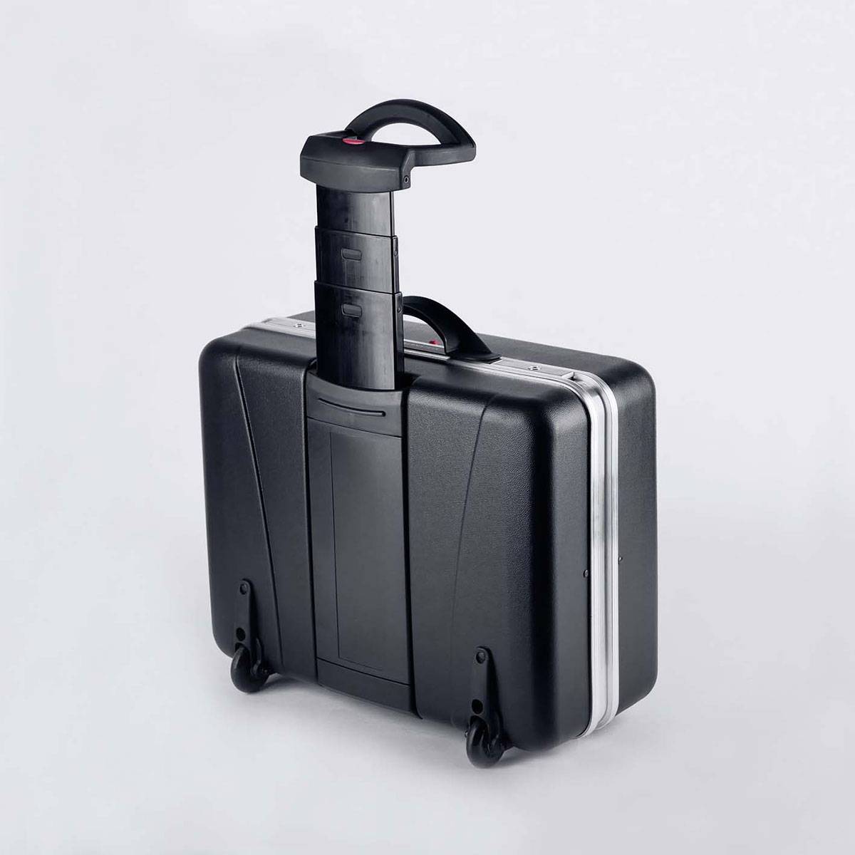 Black suitcase with telescopic handle on wheels, ready for travel.