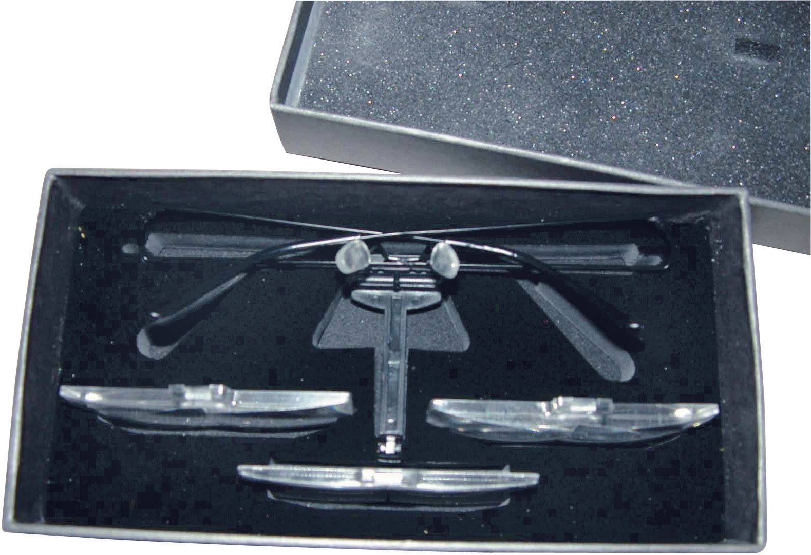 A packaging contains a pair of black glasses and two additional lenses, which are securely placed in a foam insert.