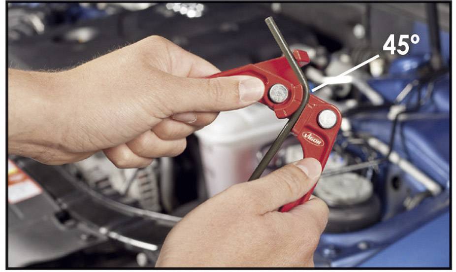 Two hands are holding a red tool and bending a wire at a 45-degree angle. A car can be seen in the background.