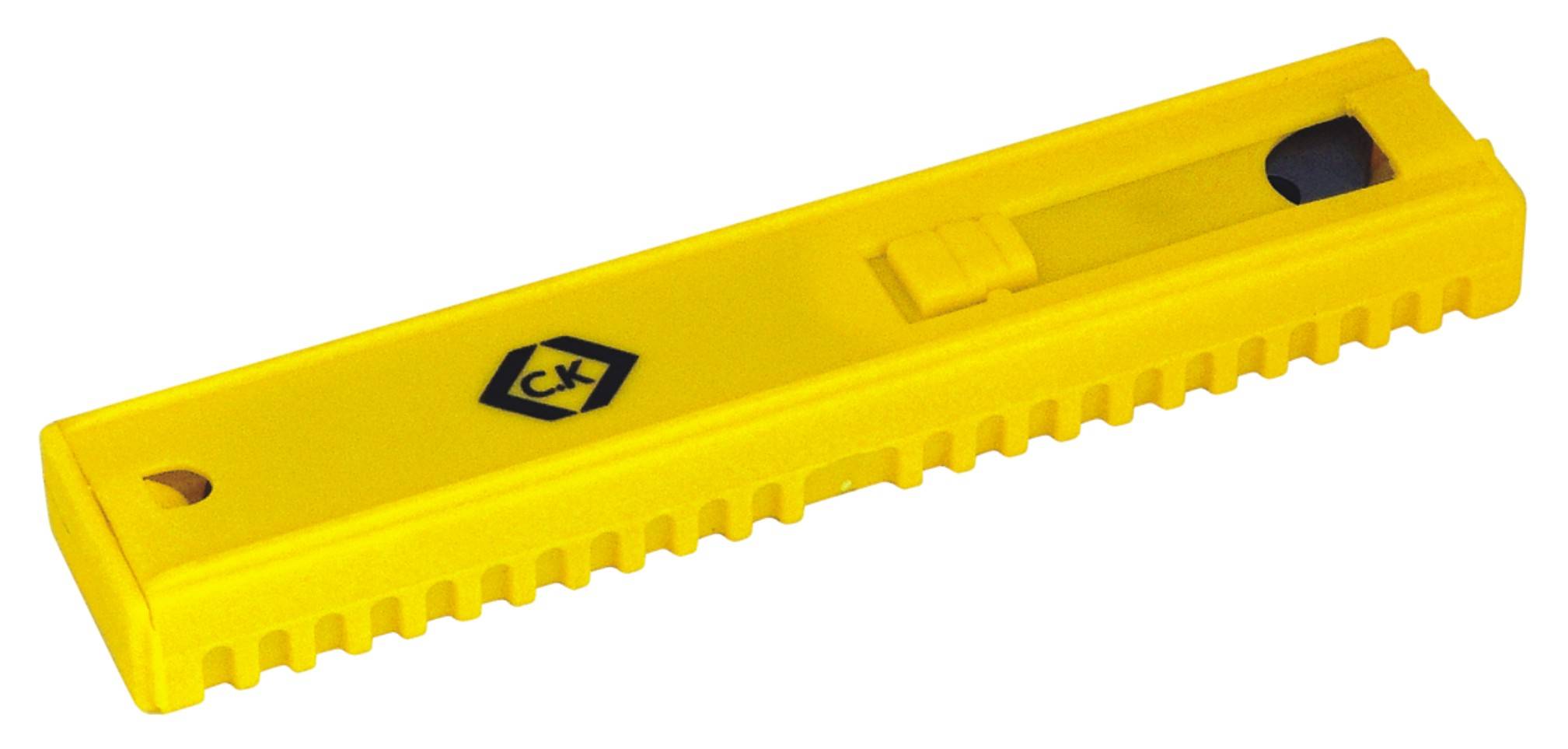 Yellow plastic tool with non-slip handle and slider, possibly a safety knife.