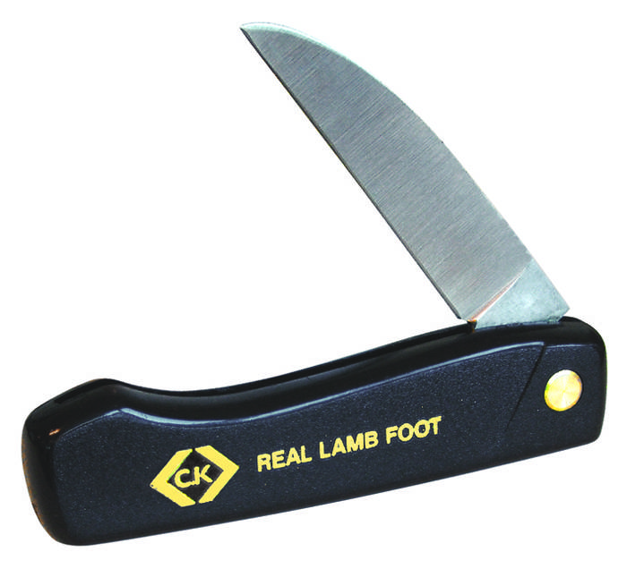 Black pocket knife with yellow lettering 'CK REAL LAMB FOOT'. Blade partially open, handle with round, yellow rivet head.
