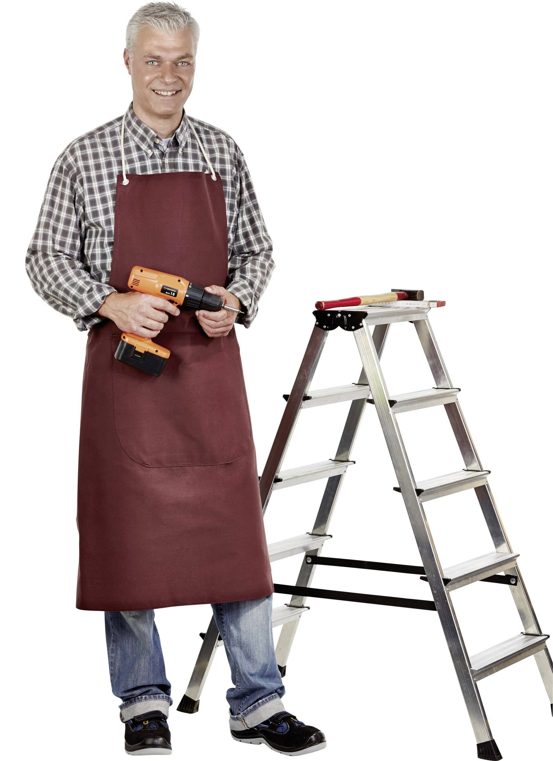 A smiling man in workwear is holding a drill and standing next to a folded ladder.