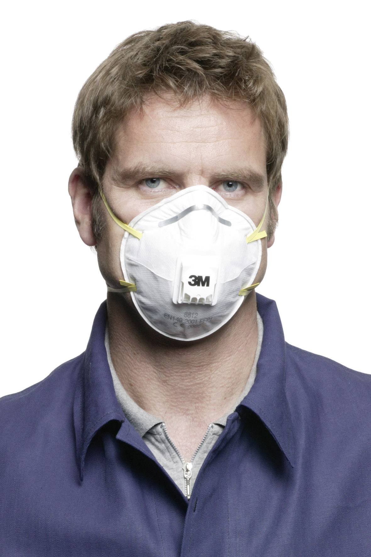 A person is wearing a respiratory mask with a 3M logo. They are wearing blue outerwear.