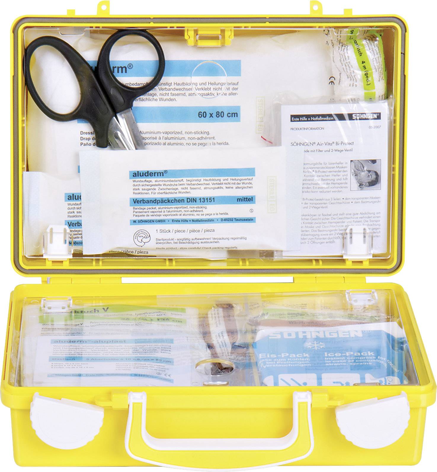 Yellow first aid kit with an open lid. Contains scissors, dressing materials and plasters. Standard-compliant equipment for emergencies.