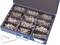 A compartmentalised open box containing various types of screws.