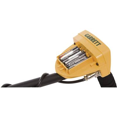 A 'Garrett' metal detector head with visible batteries, mounted on a black shaft.