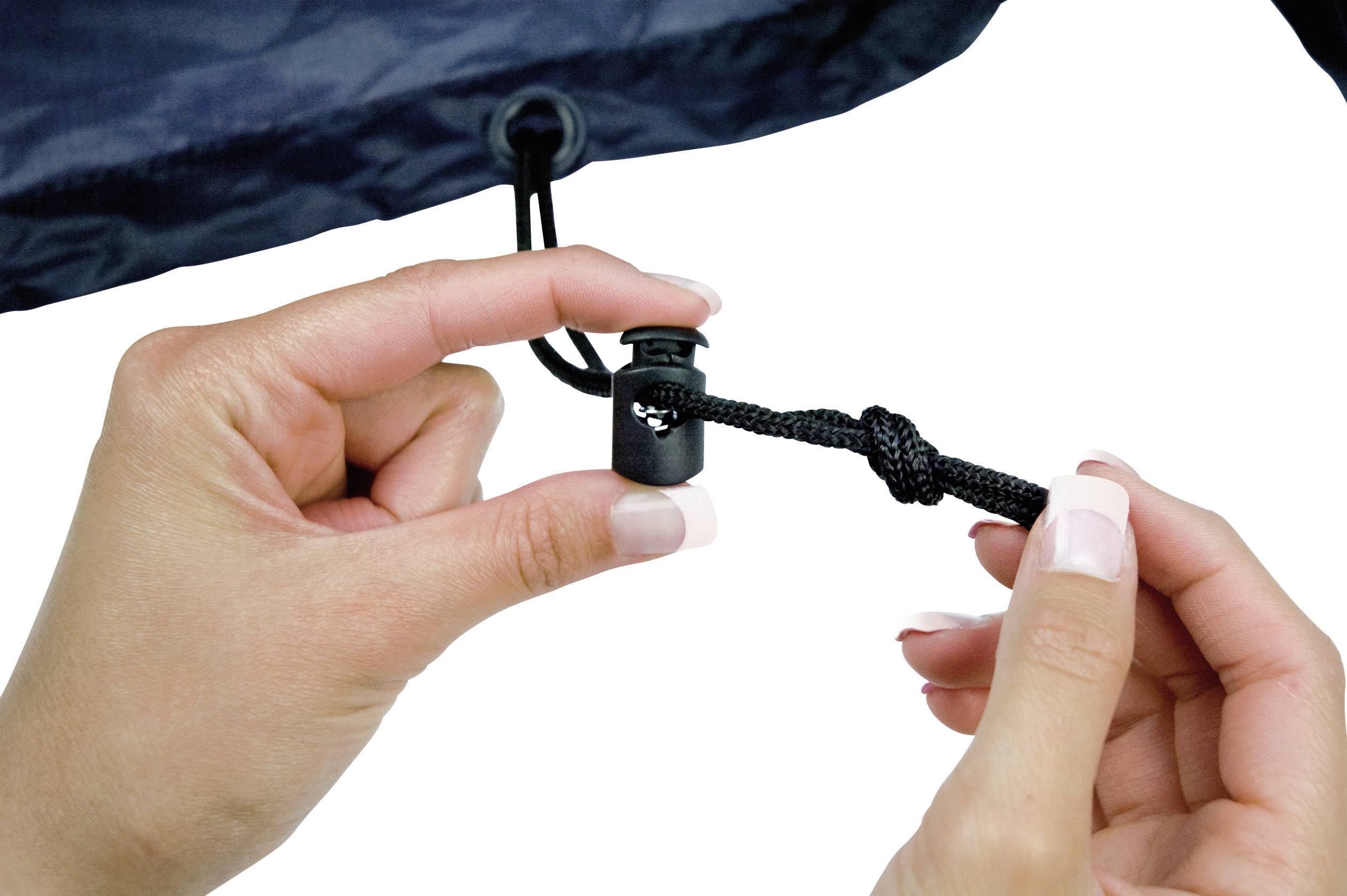 Two hands demonstrate the use of a cord stopper on a black cord. One hand is holding the button, the other the cord end.