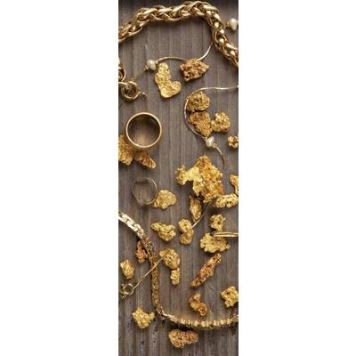 Gold nuggets and jewellery pieces are scattered across a rustic, brown wooden surface, including rings and necklaces in golden hues.